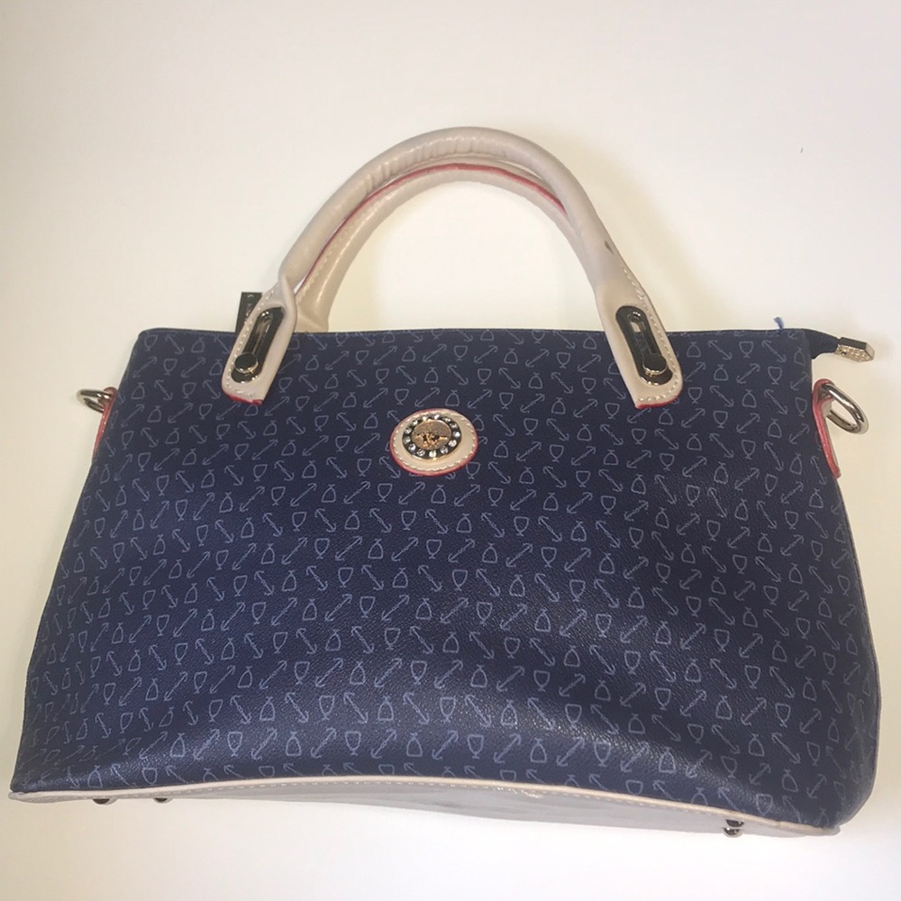 Navy patterned purse with tan and red accent